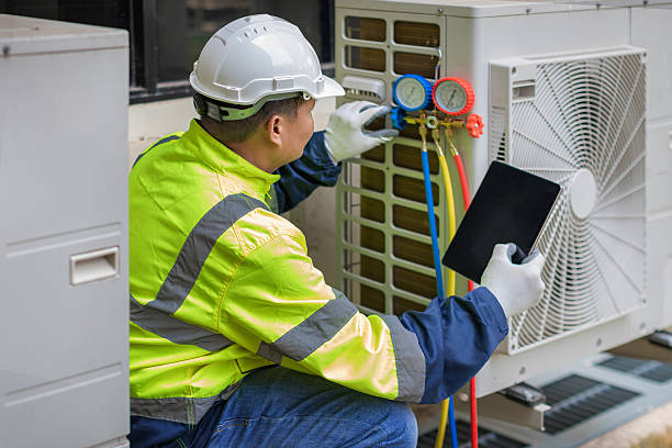Professional Heat Pump Repair technician working in Locust Valley, NY